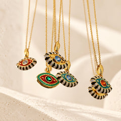 Colorful 18K gold plated evil eye pendant necklaces with enamel detailing and zircon center stones.