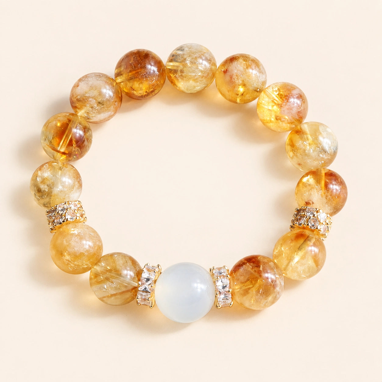 Natural citrine bracelet with golden crystal beads, white center bead and sparkling spacers