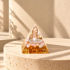 Rose quartz, clear quartz and citrine layers with a double-helix copper coil inside an orgonite pyramid