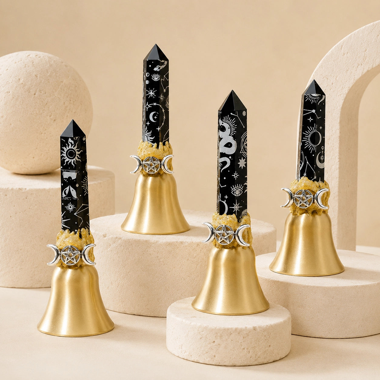 Black celestial obsidian crystal point bell with silver moon and serpent symbols, featuring a polished obsidian crystal point on a gold metal bell base.