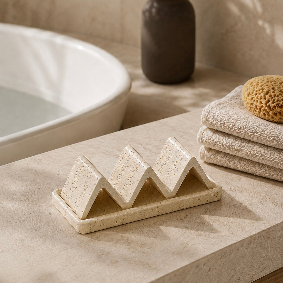 Natural sandstone soap dish beside bathtub with wave-shaped holder for spa bathroom