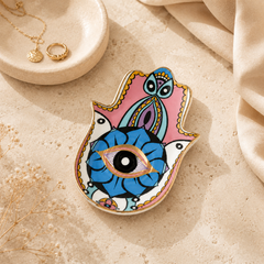 Pastel Hamsa Evil Eye Ceramic Trinket Dish for rings, jewelry, keys, and crystals with protective eye symbol and glossy ceramic finish.