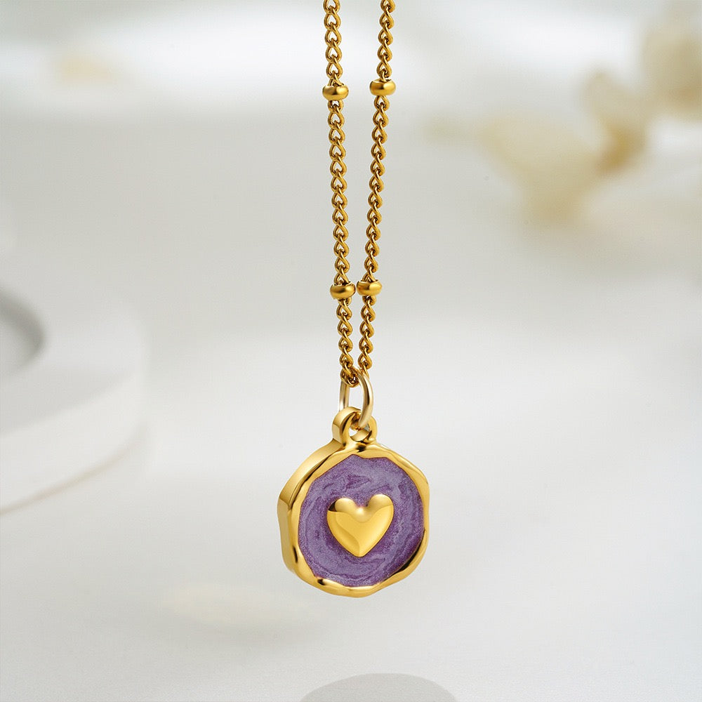 Gold-tone symbolic charm necklaces with star, moon, heart and cross enamel pendants