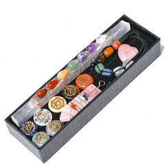 Set of crystals and tools in a box on a white background