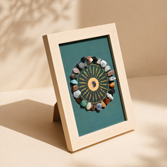 Angled view of a runestone crystal wheel display frame with gemstone wheel in a wooden stand frame for sacred decor