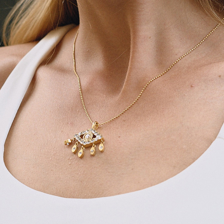 Minimalist evil eye pendant necklace on model