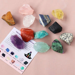 Colorful raw chakra stones aligned on an arm for meditation and healing rituals