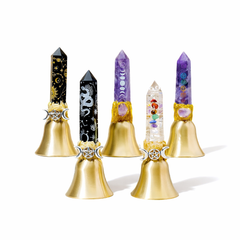 Crystal point bell set with gold bell base on neutral background