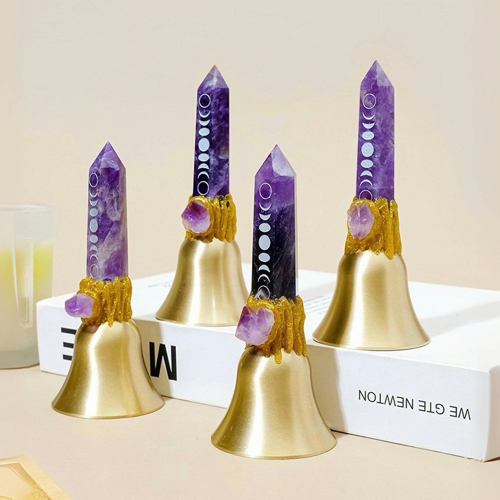 Amethyst crystal point bell with moon phase symbols