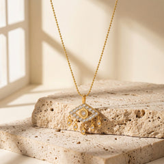 Detailed evil eye pendant with zircon stones symbolizing protection and inner strength