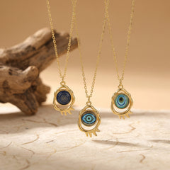 evil eye pendant necklace collection with three gold protection styles on neutral background