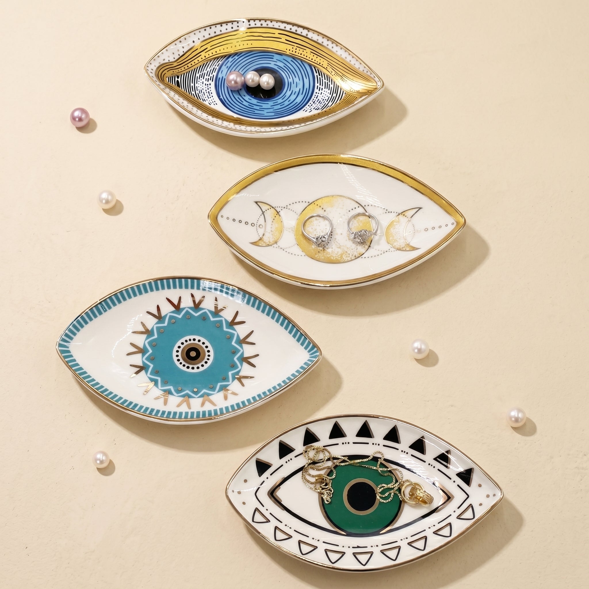 symbolic ceramic tray collection featuring evil eye and moon phase designs