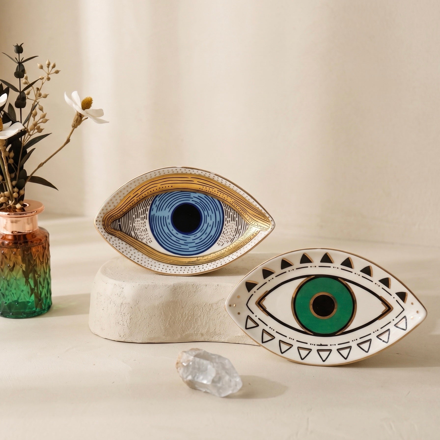 blue and green evil eye ceramic trays styled as symbolic spiritual home decor