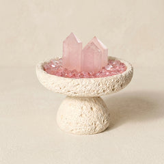 white nordic crystal cleansing bowl styled with rose quartz and cleansing stones