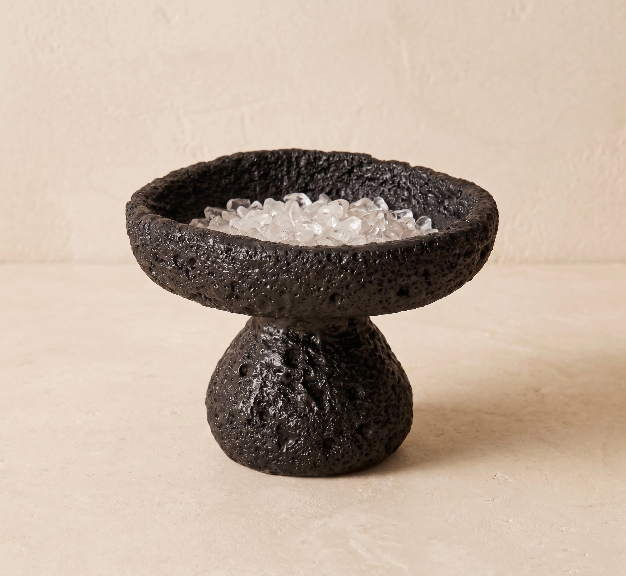 black nordic crystal cleansing bowl filled with cleansing stones for crystal reset rituals