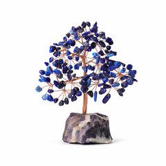 lapis lazuli feng shui crystal tree with natural amethyst base on a white background