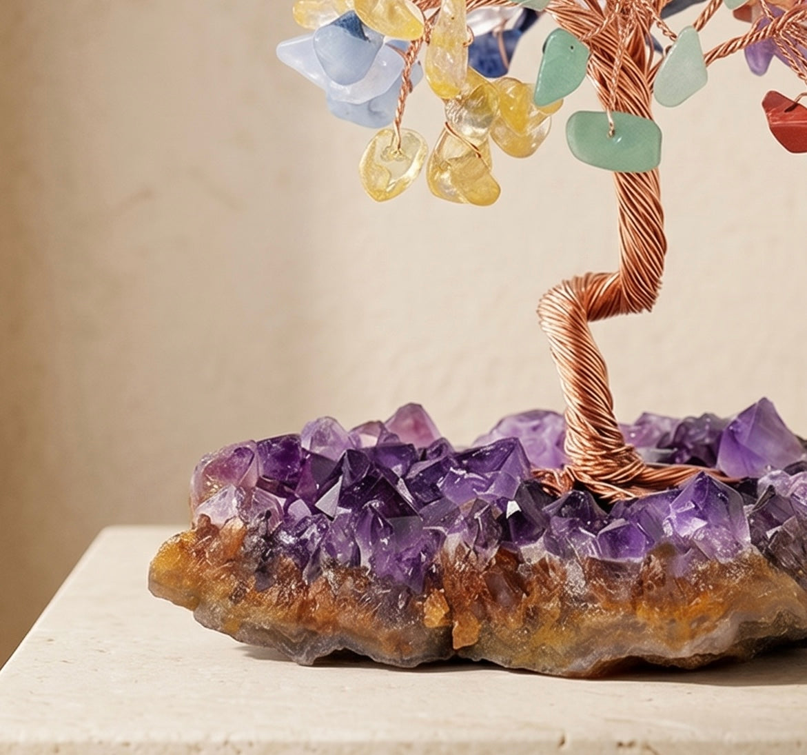 Detail view of an amethyst feng shui crystal tree with copper wire trunk and natural amethyst cluster base