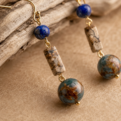 close up of lapis lazuli handmade drop earrings with copper hooks and natural stone texture