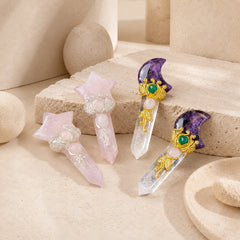 Collection of four Star and Moon Crystal Point wands in Rose Quartz and Amethyst, displayed on minimalist beige stone blocks.