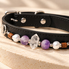Close-up of the black dog collar showing natural double-terminated clear quartz, purple amethyst beads, white accents and silver-tone hardware