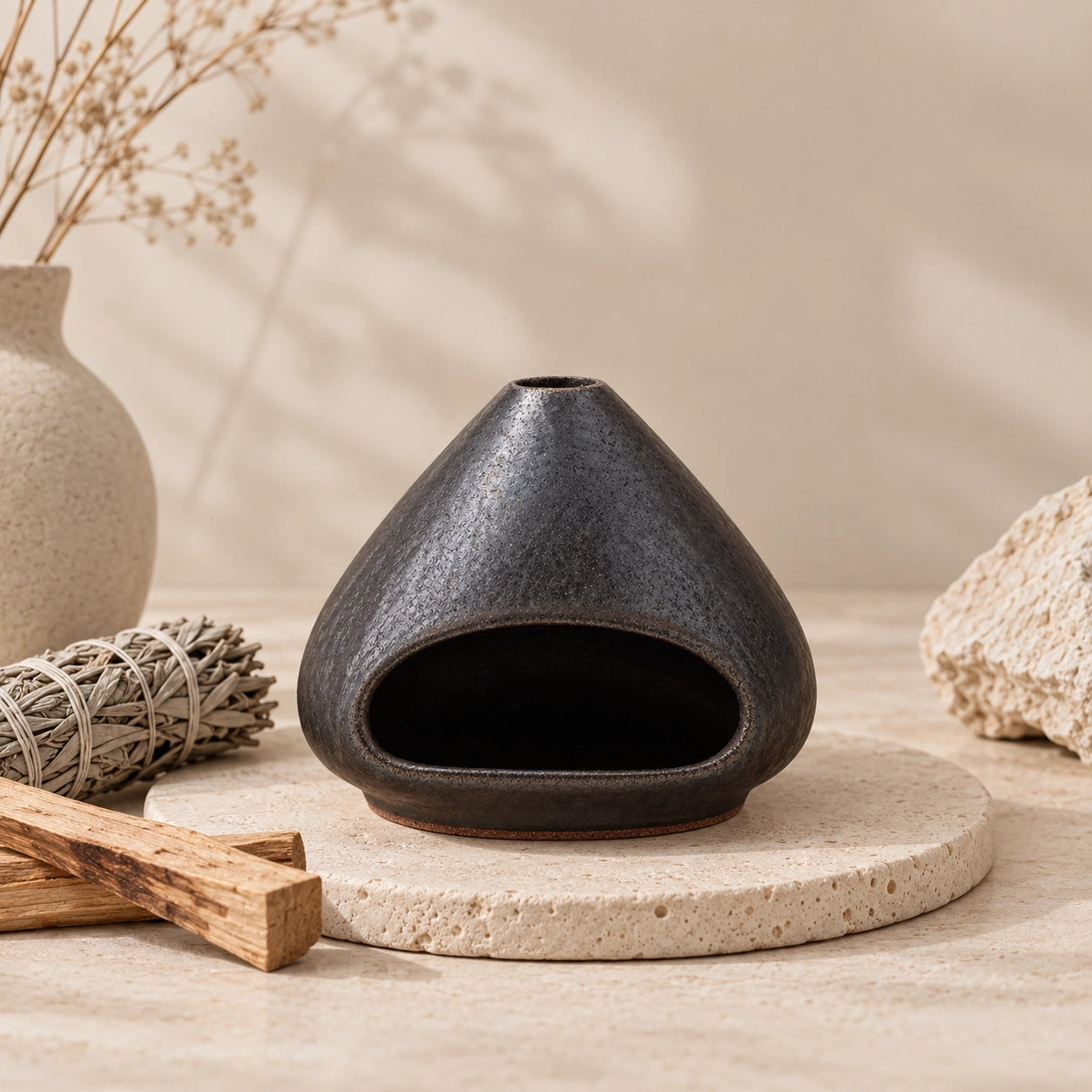 Fired Earth Brown ceramic Palo Santo and sage burner with sage bundle and Palo Santo sticks on a stone tray