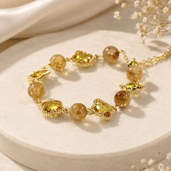 Adjustable slider chain on a natural citrine clover bracelet