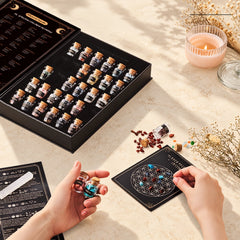 Hands creating a mini crystal grid at home with gemstones on the Flower of Life grid beside the Crystal Starter Kit