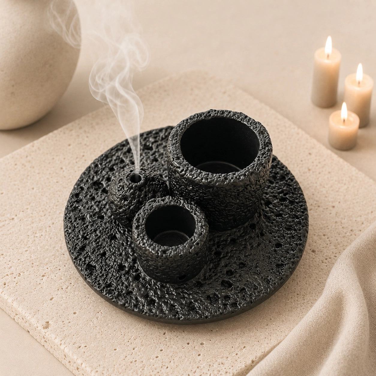 Black concrete cleansing burner with incense smoke in a minimalist Wabi-Sabi ritual scene