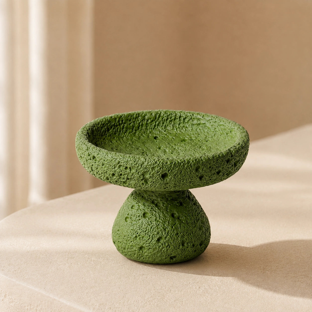 Green textured cement crystal holder bowl styled in a warm minimalist home setting