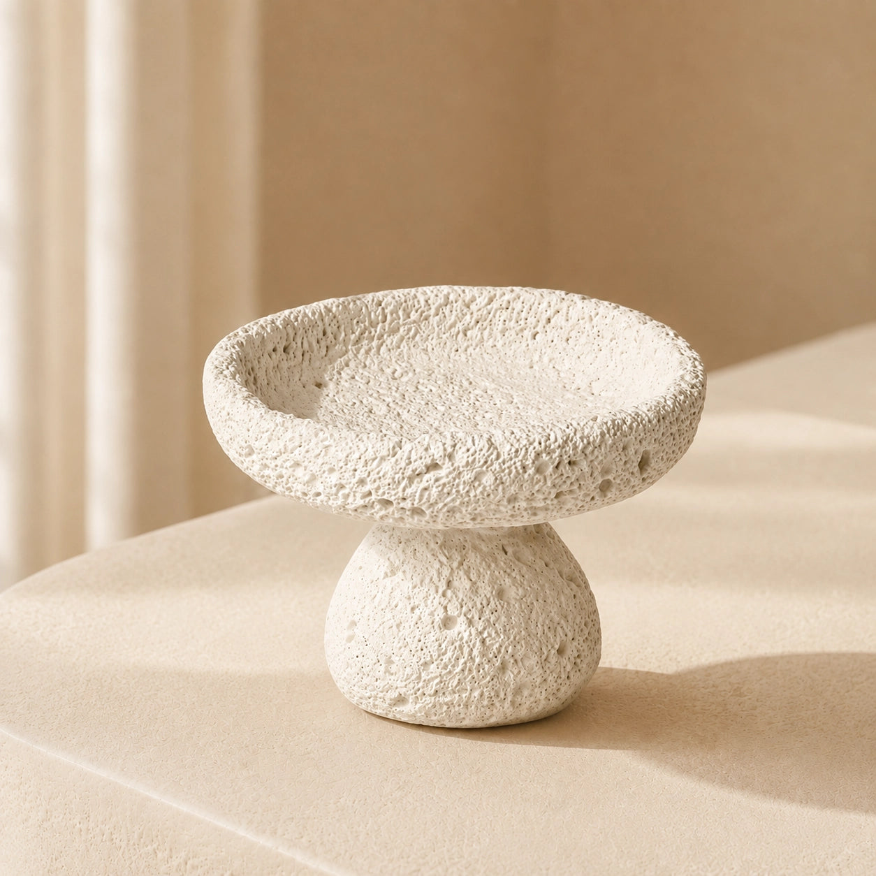 White textured cement crystal holder bowl in a calm sunlit Nordic interior