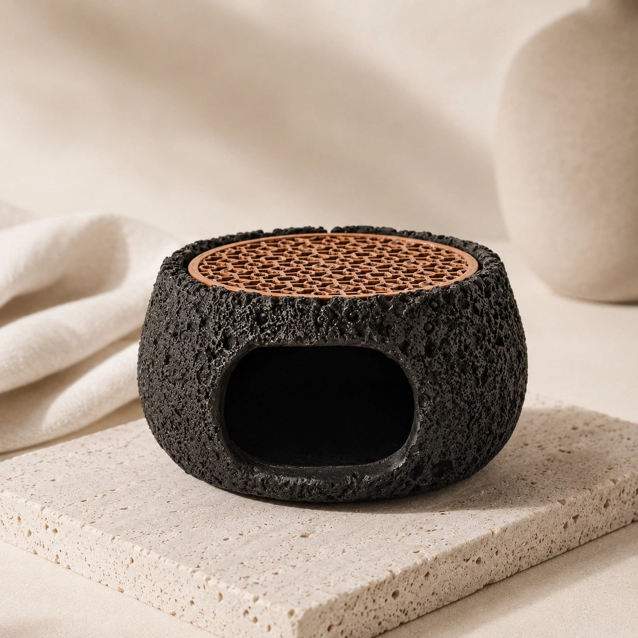 Black textured cement cleansing burner with copper grill for sage, palo santo and resin incense