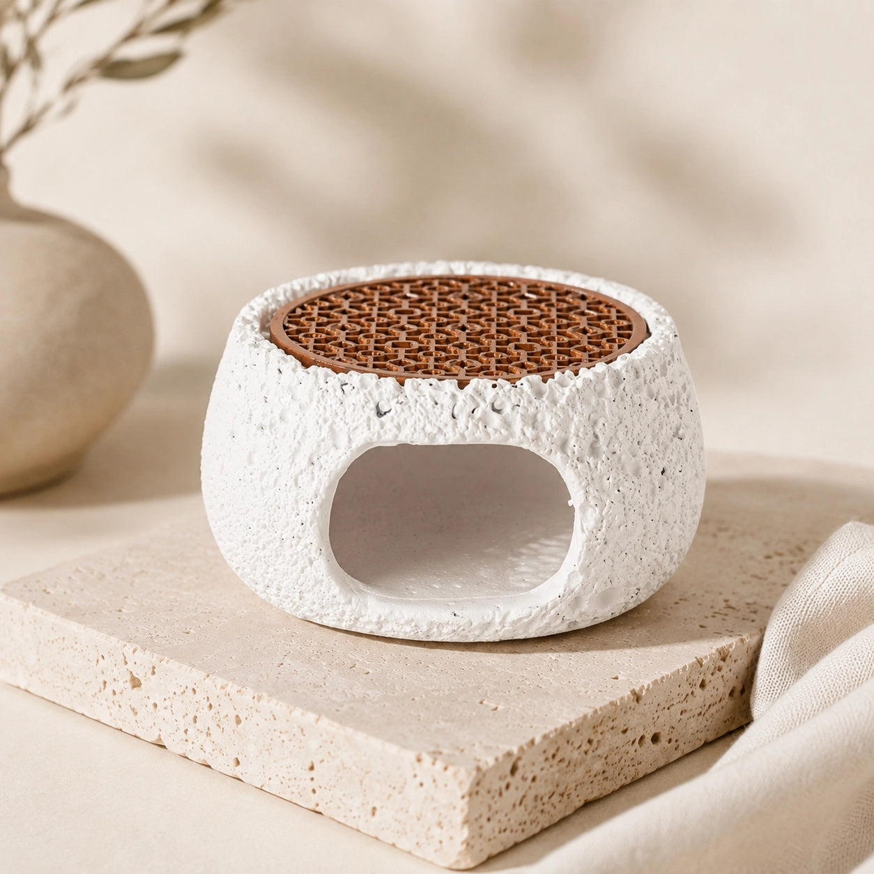 White textured cement sage and palo santo burner with copper grill for crystal cleansing rituals