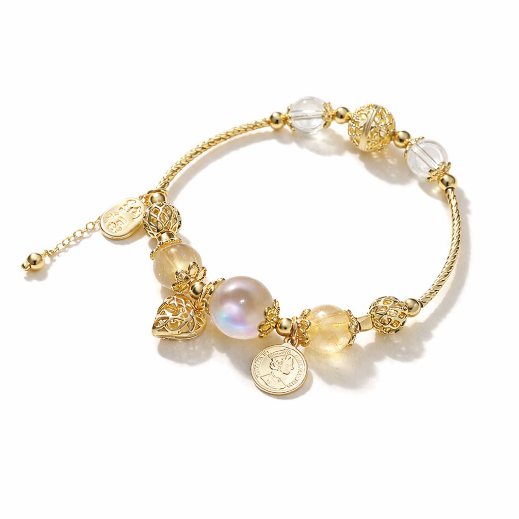 Citrine, Moonstone & Clear Quartz Bracelet  with various beads and charms on a white background