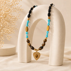 Boho crystal necklace featuring tiger eye turquoise and natural stone details for protection energy