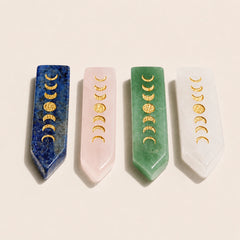 Moon phase crystal wands in Lapis Lazuli, Rose Quartz, Green Aventurine, and Clear Quartz with gold lunar engravings