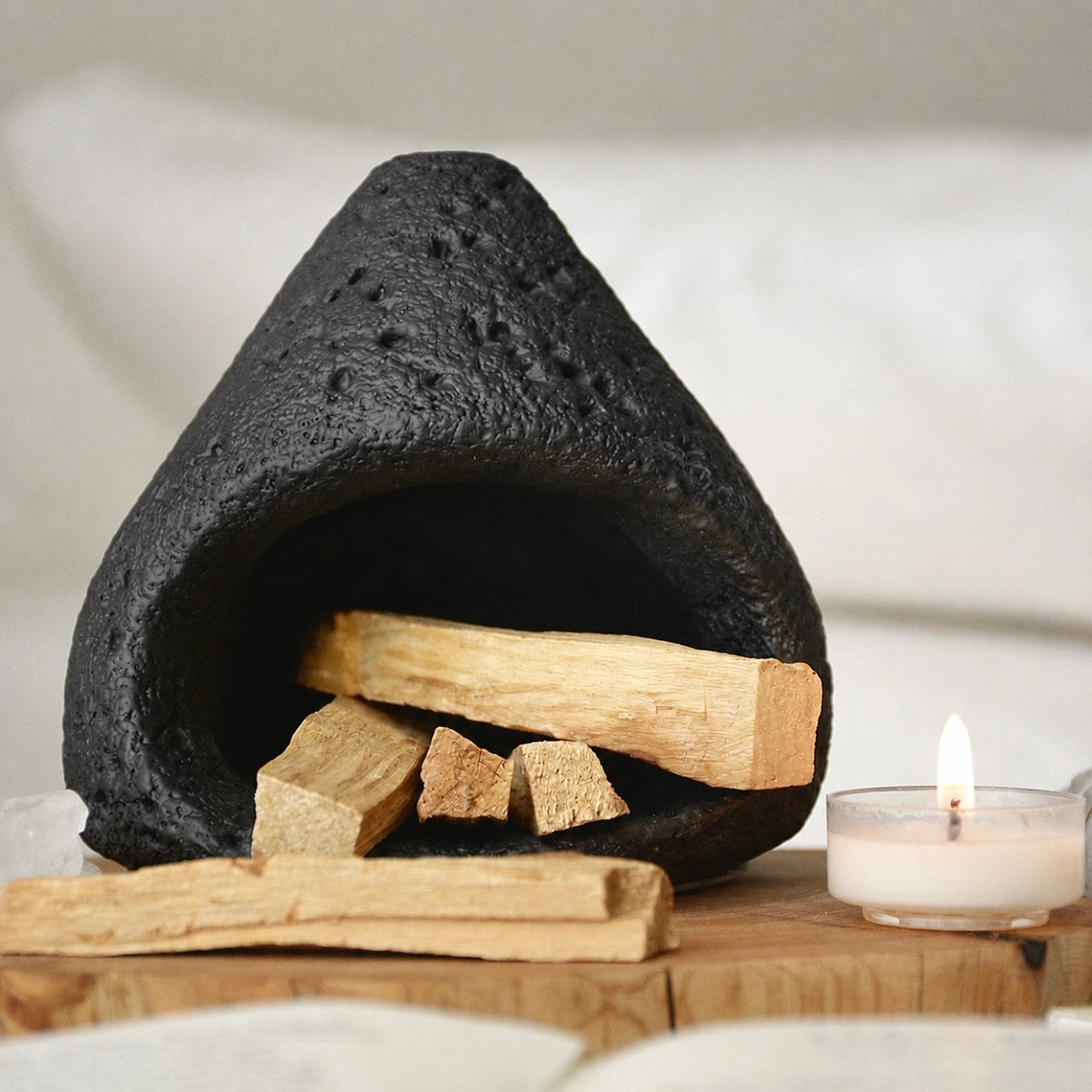 Black ceramic smudge bowl designed for incense and ritual smoke cleansing.