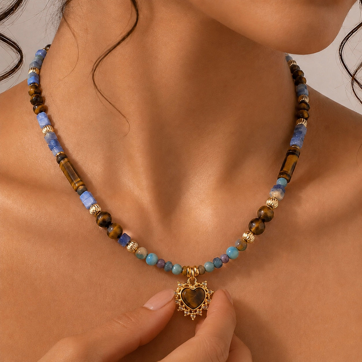 Model Wearing Tiger’s Eye and Sodalite Heart Necklace