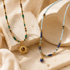 Close up of sunflower crystal necklace showing boho pendant design and natural crystal stone accents