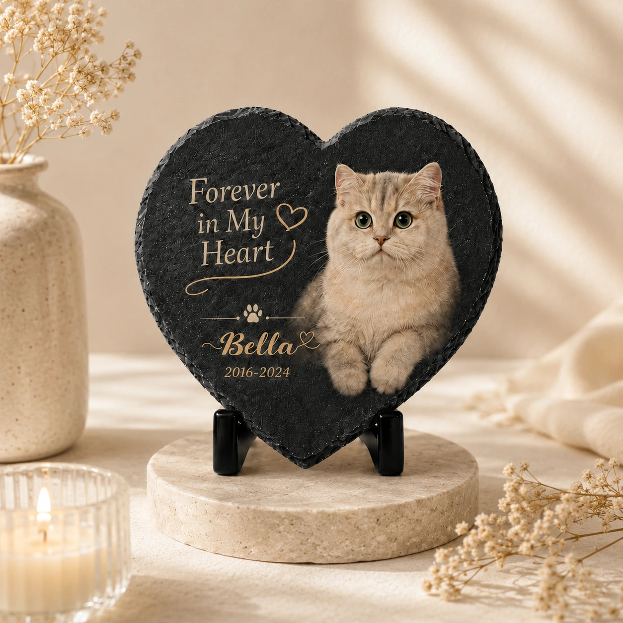 Heart-shaped custom cat grave marker displayed in a warm remembrance setting