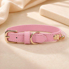 Adjustable pink PU leather dog collar with polished gold-tone buckle and D-ring