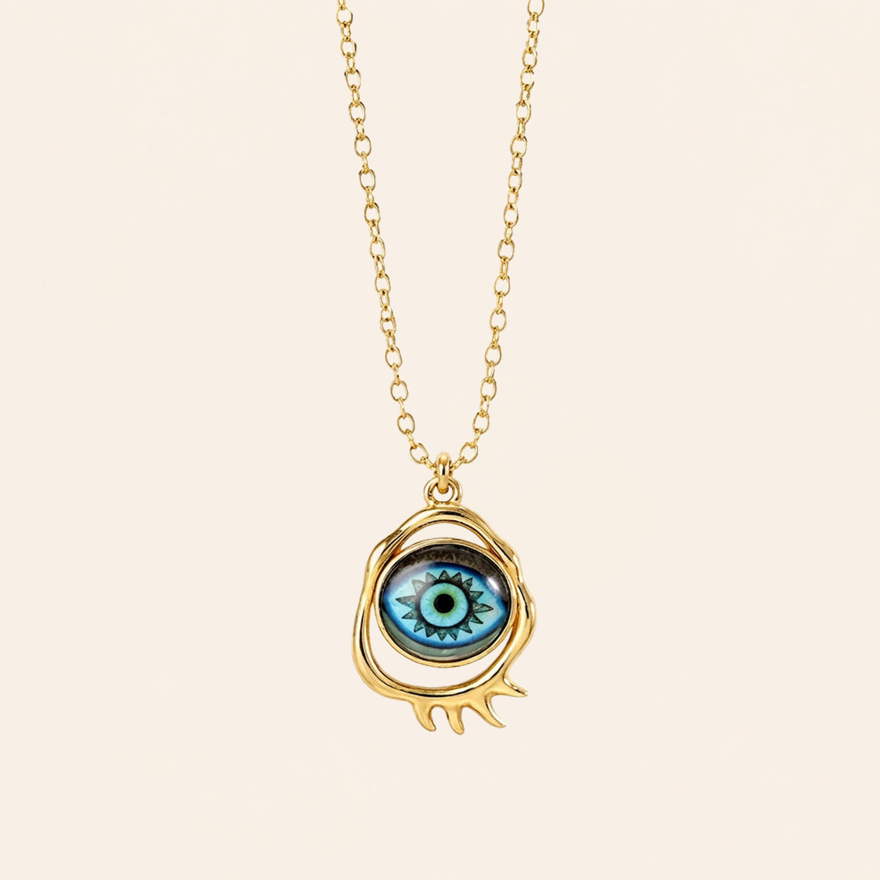 gold evil eye pendant necklace with classic blue eye design on neutral background