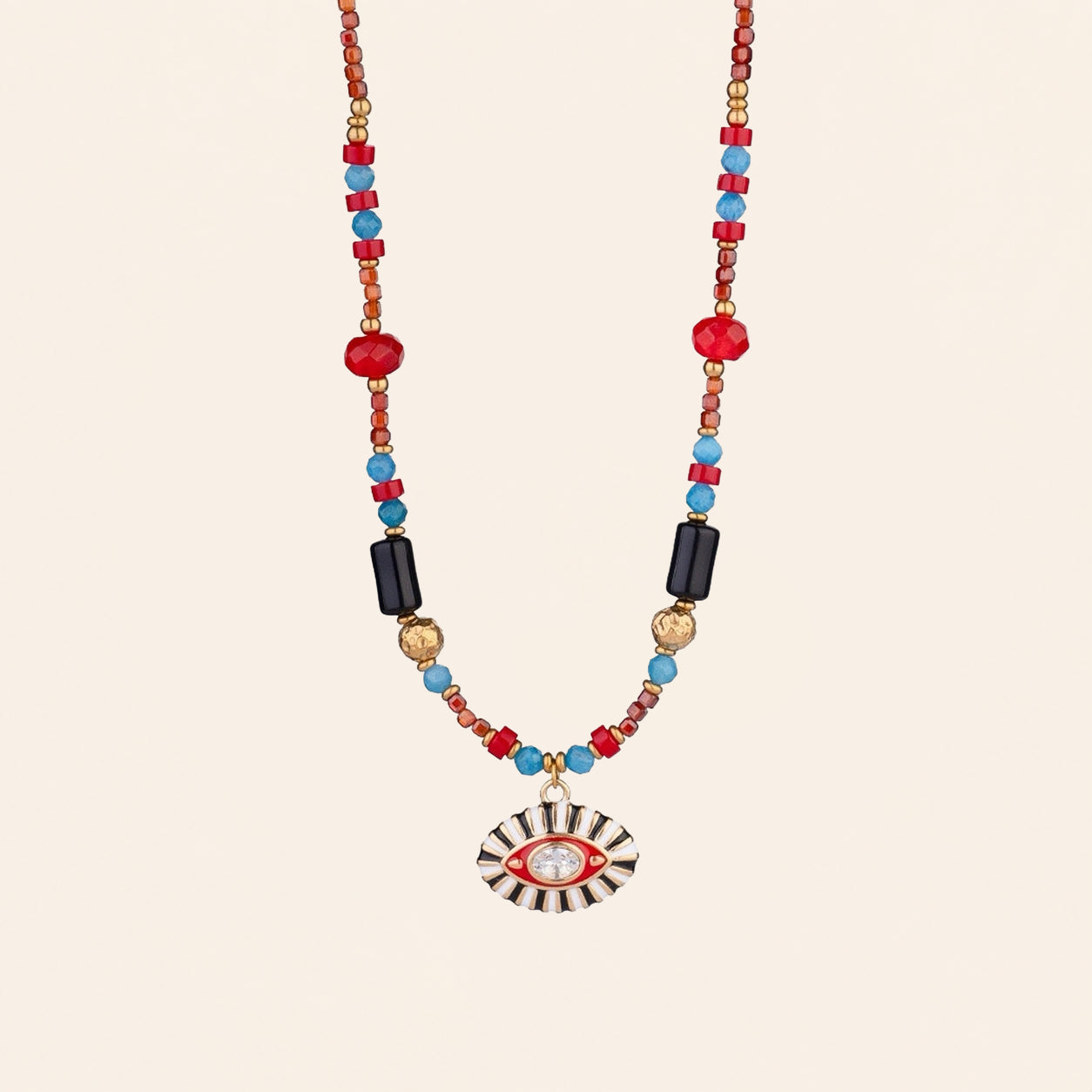 Evil Eye gemstone necklace with red agate, turquoise, black onyx and hematite beads on a cream background