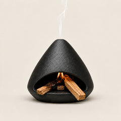 Black ceramic Palo Santo and sage burner with open hearth and top smoke vent for energy-cleansing rituals