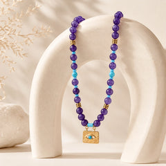Boho evil eye necklace with amethyst, turquoise, obsidian, and tiger’s eye beads