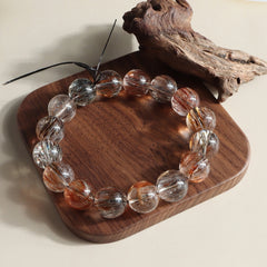 black gold rutilated quartz bracelet styled as spiritual jewelry for protection and focus