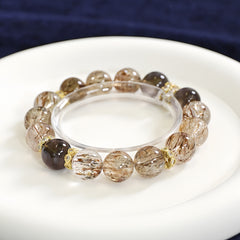 Golden rutilated quartz and smoky quartz bracelet for wealth, grounding, and energy healing