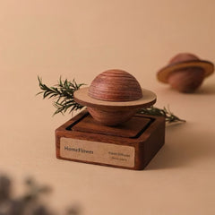 Wooden diffuser with spherical design on a beige background