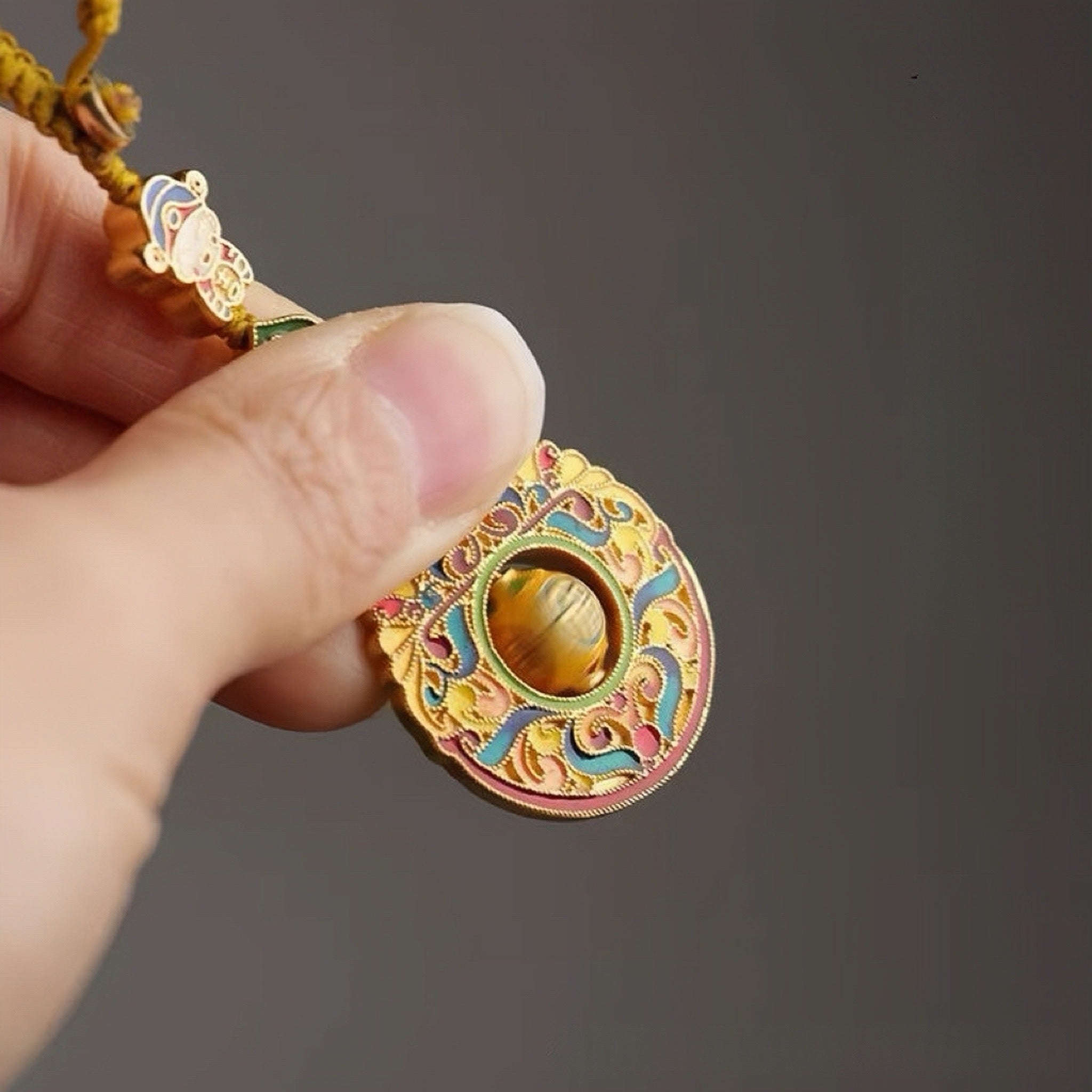 Feng Shui charm keychain with rotating fortune bead and traditional design