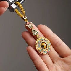 Chinese-inspired Feng Shui pendant with symbolic gourd and fortune motif