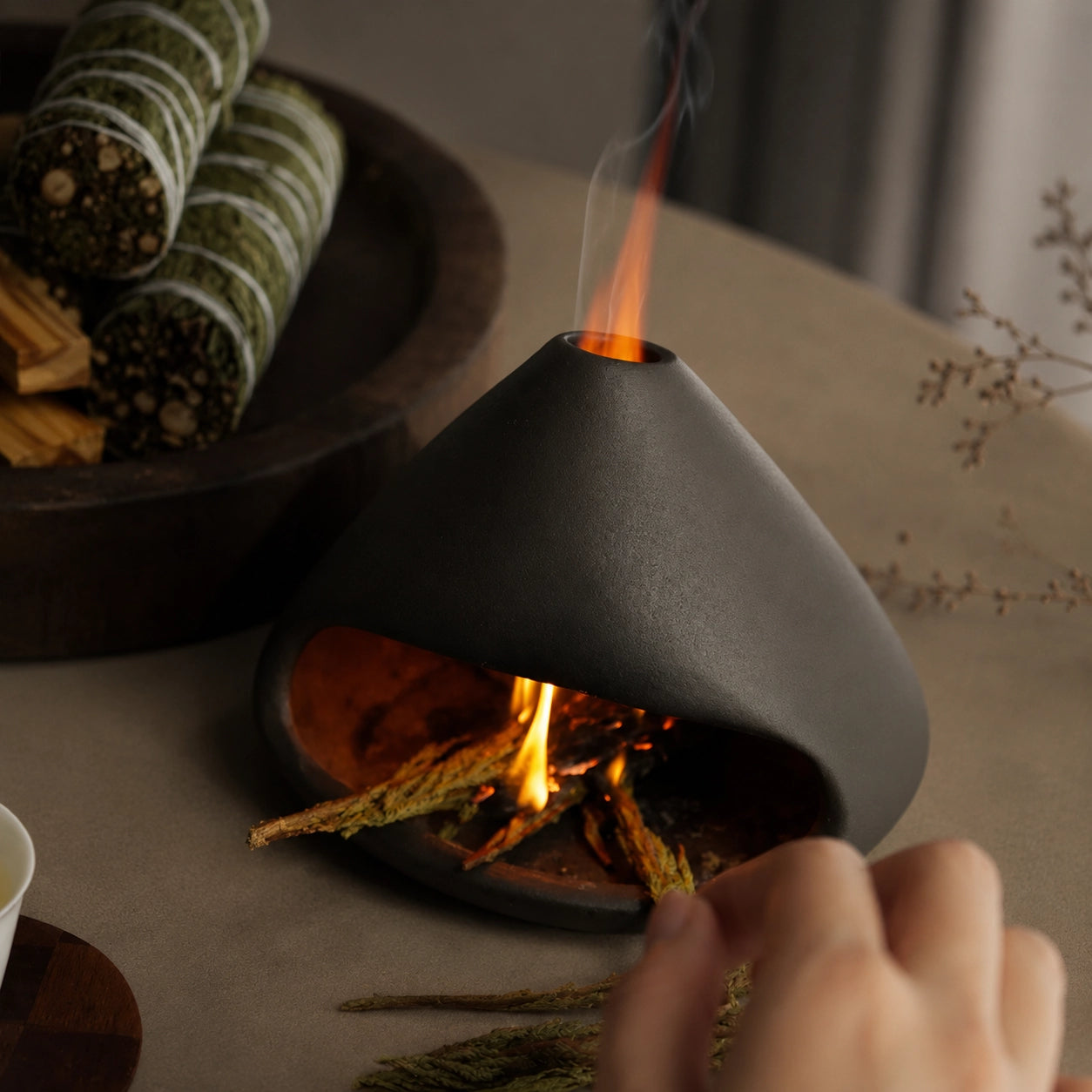 Mount Fuji Ceramic Incense Burner burning sage with smoke rising through the top opening.